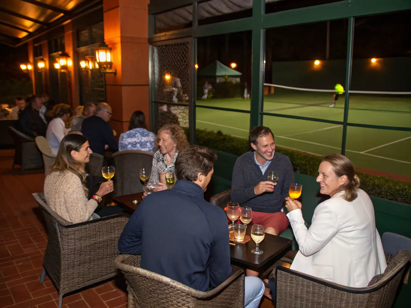 A group of smiling members of TCFD gathered for a social event at the clubhouse, highlighting the club's strong sense of community and camaraderie.